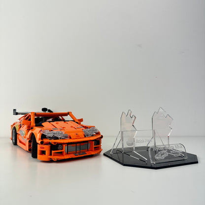 Lego Toyota Supra MK4 model with black acrylic base for display
